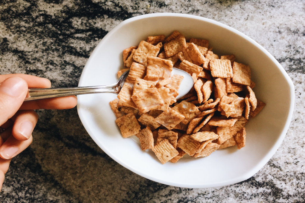 Homemade Cinnamon Toast Crunch squares on a baking sheet, golden brown and coated with cinnamon sugar.