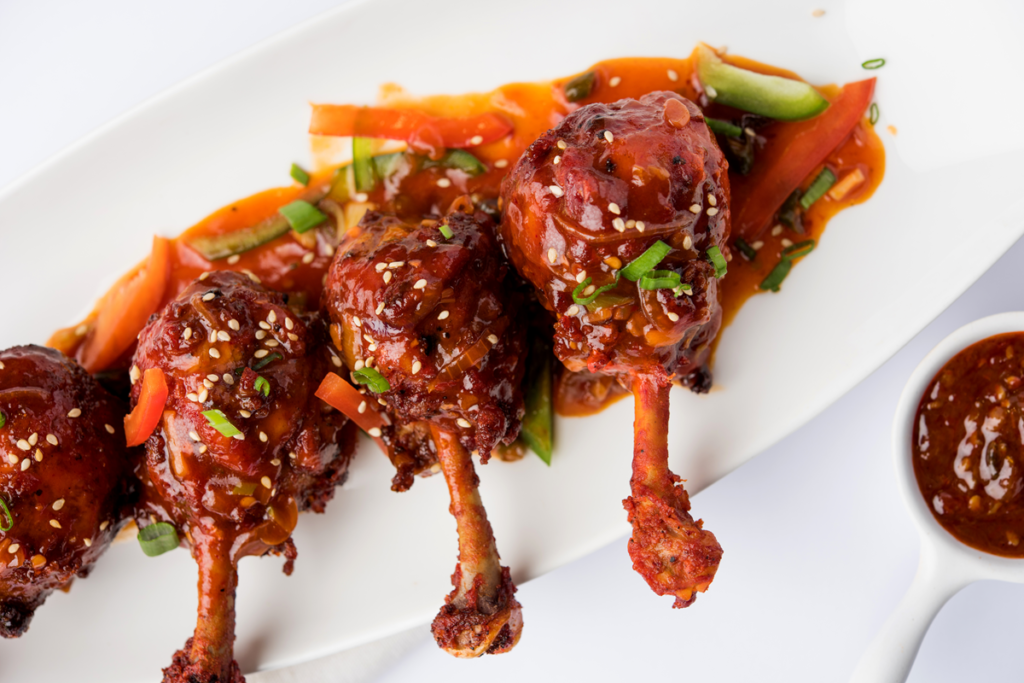 Hot honey chicken thighs with crispy skin and hot honey glaze.