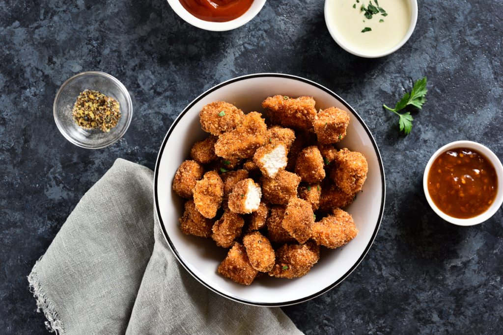 Crispy frozen popcorn chicken on a plate