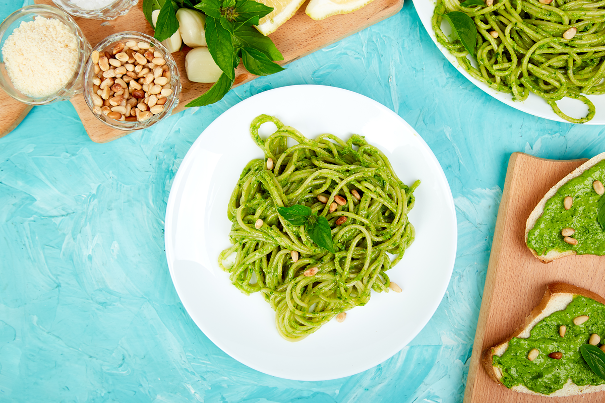 Plate of homemade green spaghetti with basil pesto