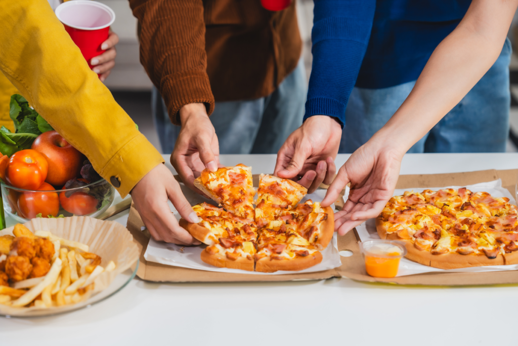 A slice of homemade school pizza on a baking sheet.