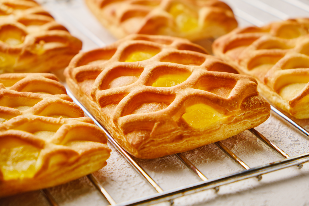 Golden puff pastry mini pies filled with pear and lemon.